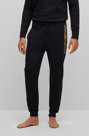 Pamučni donji dio trenirke s logotipom i prugom