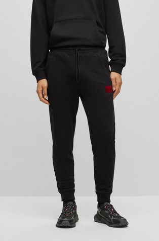 Pamučni donji dio trenirke sa svjetlucavim plišanim logo našivkom