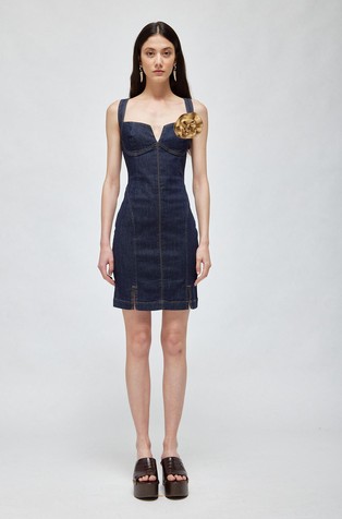 Denim sheath dress with rose brooch