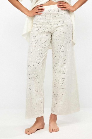 Wide cotton trousers with perforated embroideries