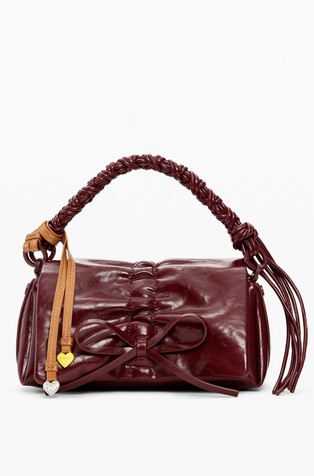 Manja sjajna torbica s mašnom