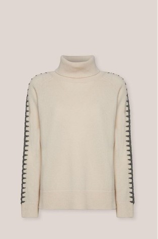 Pletena vunena dolčevita s kontrastnim ukrasnim šavovima