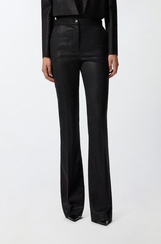 Hlače s metalno svjetlucavim vlaknima i prorezom na nogavicama