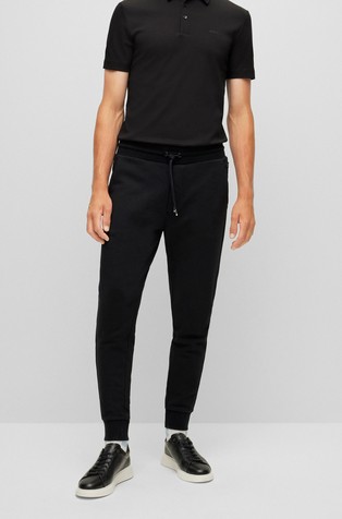 Pamučni donji dio trenirke s gumiranim logotipom